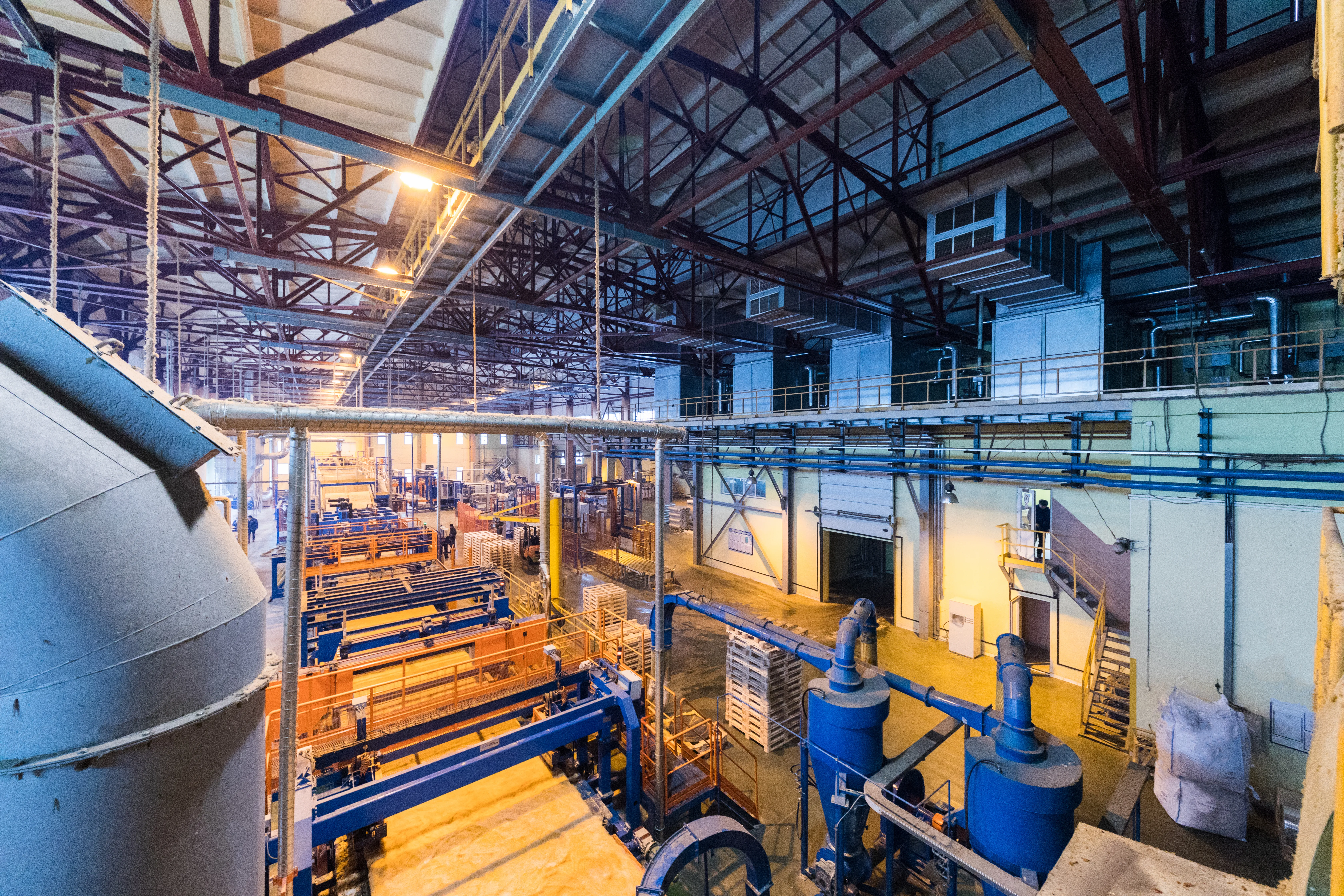 Fiberglass production industry equipment at manufacture background